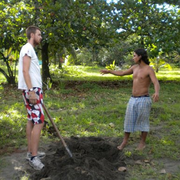 GLBL student standing in a garden with a local person