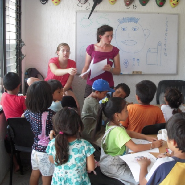 GLBL student in a classroom with children