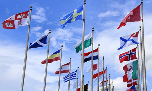 Flags of many countries flying in the wind