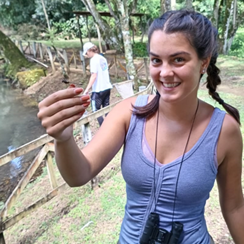 GLBL Student holding small insect in Costa Rica
